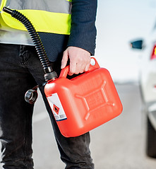 man-with-refuel-canister-on-the-roadside-2026-03-24-00-10-59-utc_edited.jpg