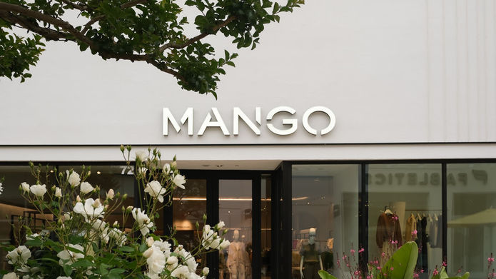 Exterior entrance of a Mango retail clothing store completed by Pacific Wide Construction, featuring custom storefront signage and modern retail architecture.