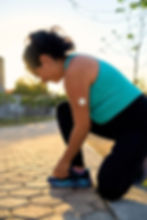 young-latin-sportswoman-tying-hair-with-glucose-se-2025-04-10-22-00-27-utc.jpg