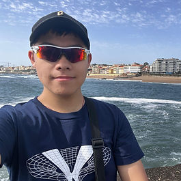 A dual major in computer science and math, Quinten Jin has really been making it count as Magevet’s newest Bostonian Magevateer. A deep and wide-ranging thinker, with a vocal range to match, he can just as easily tell you about literature, politics, or Chinese opera as he can about why math and computer science are for more than just counting puns.
A true artist, when Quinten isn’t singing tenor, he’s pulling flowers from negative space in elaborate and mesmerizing paper cuts. Or maybe he’s busy keeping the YPU on track. Or perhaps reading recently published scientific articles. Or coding for new projects. Of course, whatever he’s doing, he’s bringing his musical ear, powerful voice, and quiet exuberance to every Magevet performance.