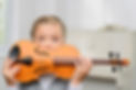 child holding violin