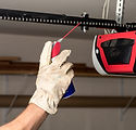 Applying Oil to Chain of Garage Door