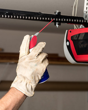 Applying Oil to Chain of Garage Door