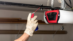 Applying Oil to Chain of Garage Door