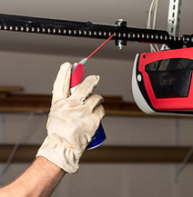 Applying Oil to Chain of Garage Door