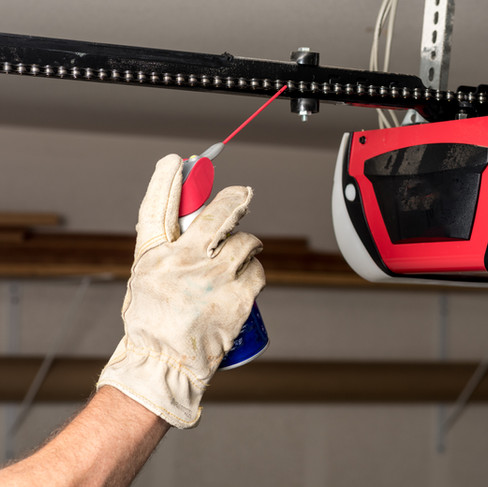 Oil garage door opener chain periodically