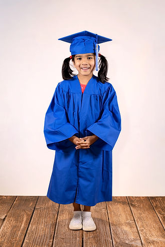 Preschool graduate smiling during picture day in Austin, Texas.