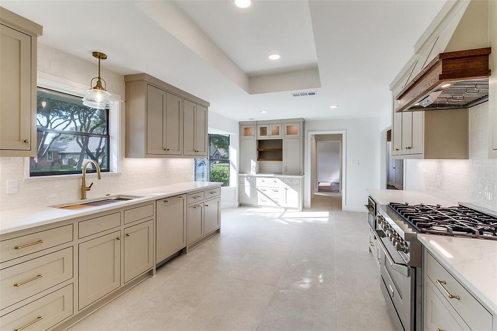 A beautifully curated and modern galley-style kitchen featuring custom shaker cabinetry, high-end chef appliances, and warm design finishes.
