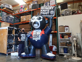 Giant inflatable monkey knife fight