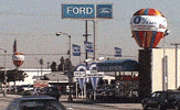 rotating_inflatable_sale_balloons.gif