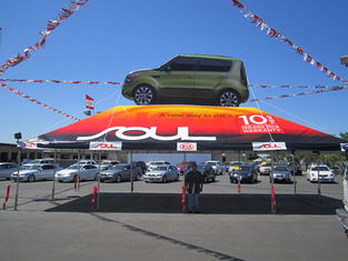 20x40 Frame tent with inflatable car Kia Soul at car dealership