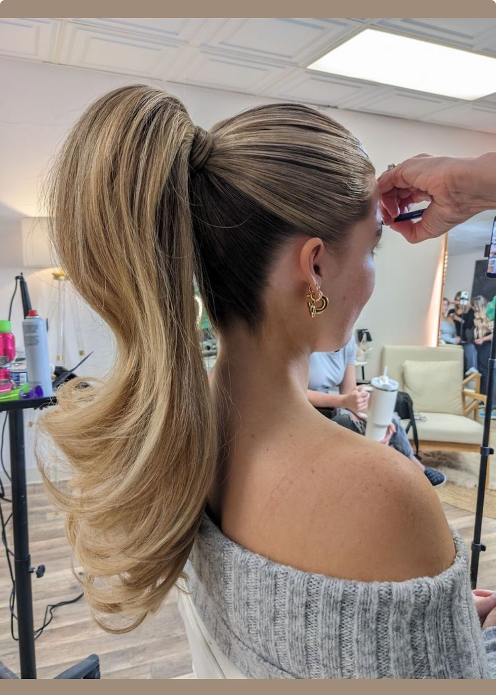 A high glam ponytail on a bride