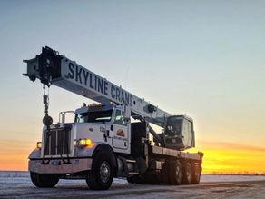 a boom truck in the dusk