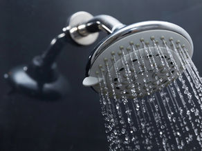 Low-flow shower head in a bathroom.