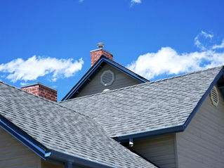 A close-up of asphalt roofing on a home