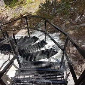 Handrail and landing detail on hillside exterior stair