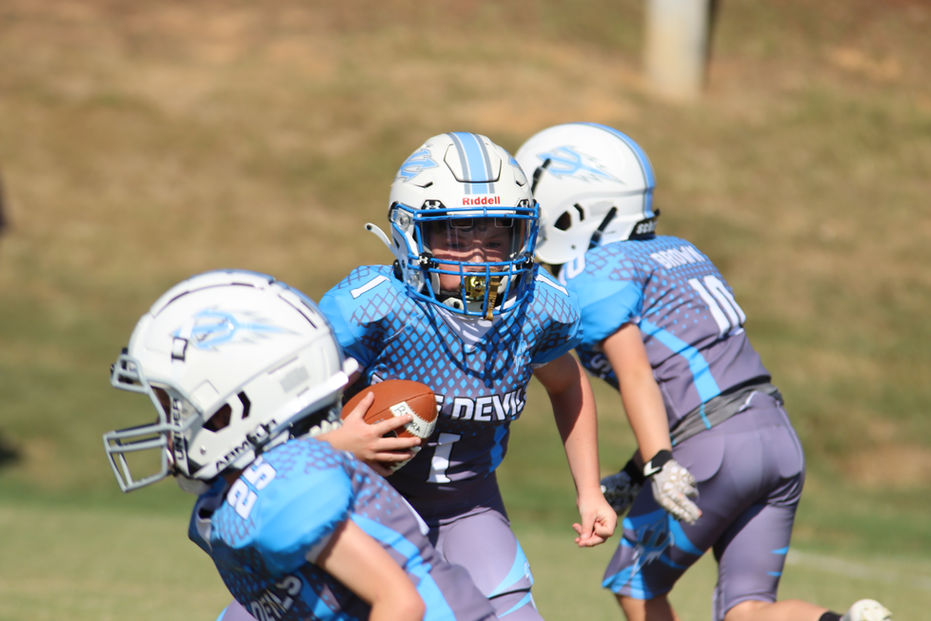 Youth football players in action
