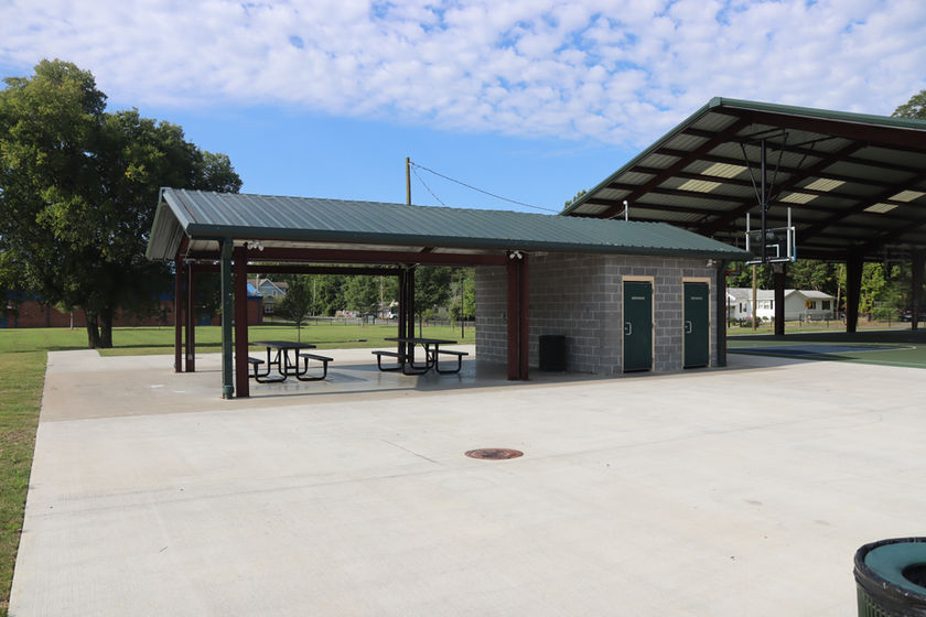 Park Pavilion with picnic tables and bathrooms