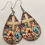 Thumbnail: Wooden Floral Cross Faux Leather Teardrop Earrings