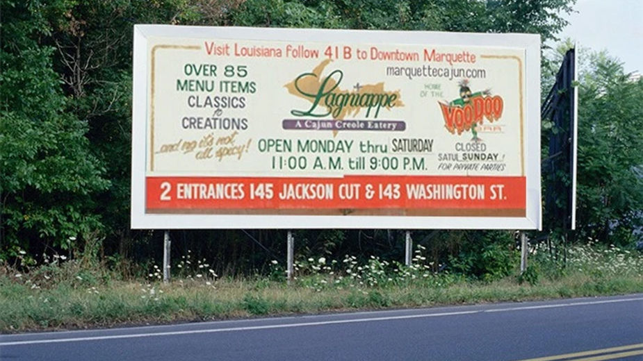 Can you hear the rumbling? That means your crossing the double-yellow center line trying to read this board. Too many words and poor design create absolute visual chaos for this board and any oncoming traffic.