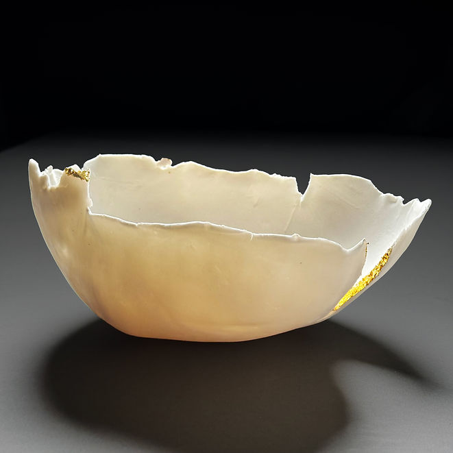 Unglazed porcelain with 23K gold leaf detailing. 10.25" x 9" x 4.5".