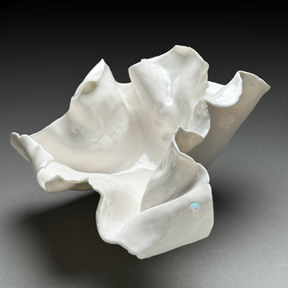 High gloss white glazed ceramic sculpture in porcelain with embedded fiery opal.