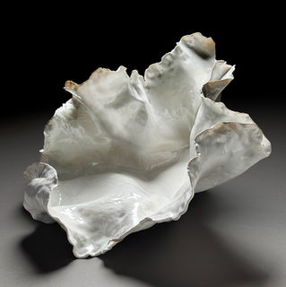 Hand-formed ceramic sculpture tin porcelain finished in high gloss white glaze. 21" X 18" X 11".