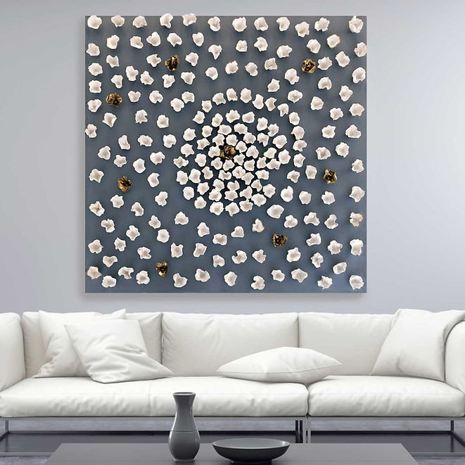 LA's Hollywood Celebrity Designer Kari Whitman Commissions Wall Art, "Elan Vital III", a piece made up of more than 100 hand-formed porcelain sculptures in white and bronze, set on a French blue background 48" x 48" art panel.