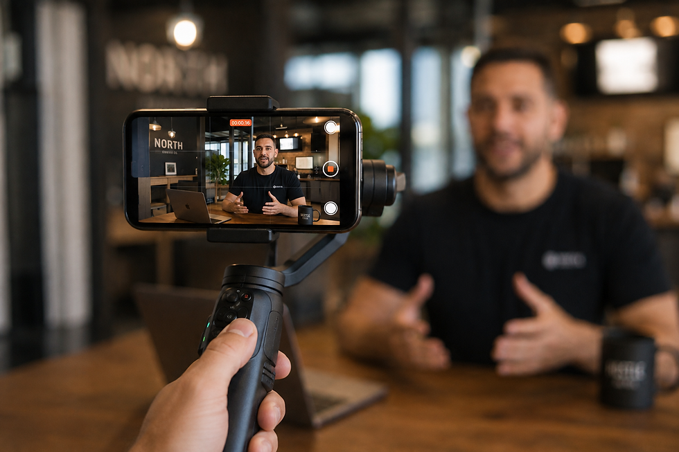 Man recording a business video on a smartphone gimbal.