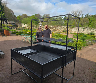 Handcrafted stainless steel BBQ and fire pit.