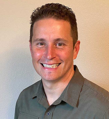 Profile photo of podcast guest, Sean Campbell, smiling against a neutral background.