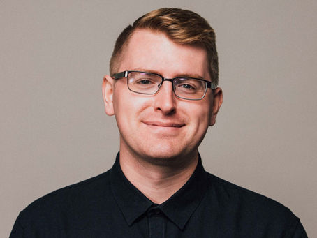 Brennan Haelig speaking during a podcast interview about building a service business from freelancer to agency owner