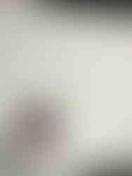 A large piece of paper with colorful markers in a cup and "what will you do to help the earth?" handwritten over a drawing of the earth.