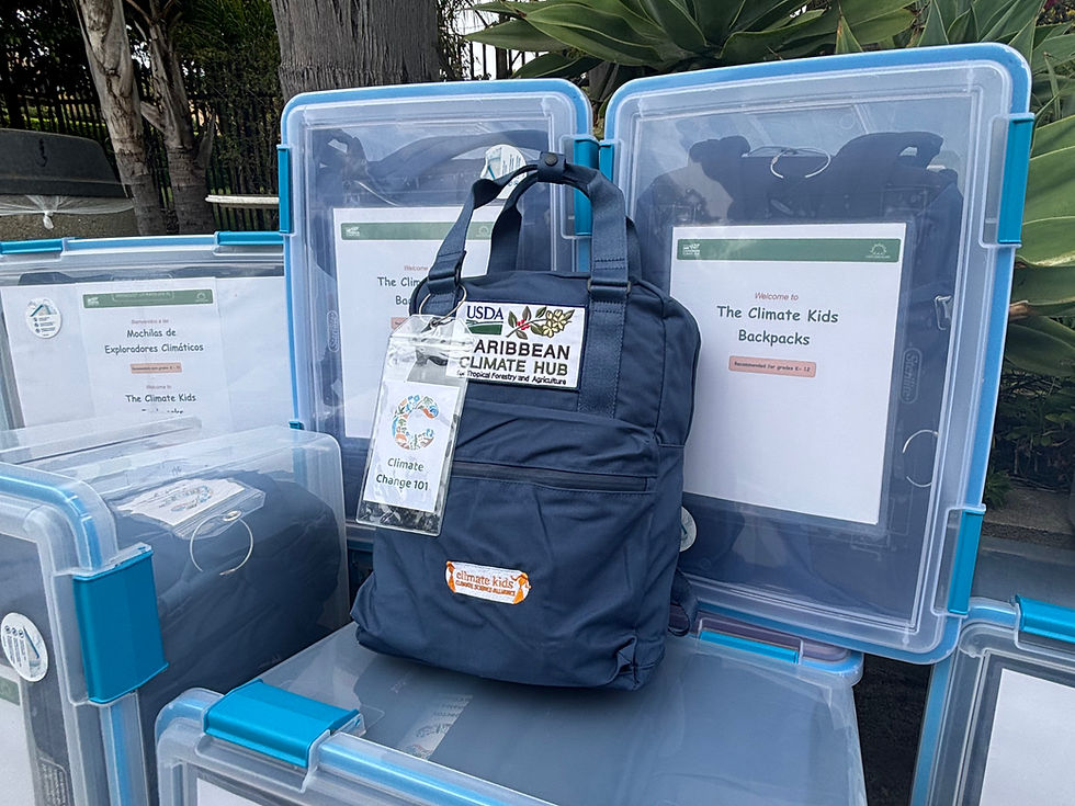 A blue Climate Change 101 Backpack sitting atop multiple clear bins full of additional Climate Kids educational materials.