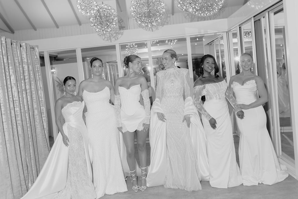 Six models in elegant Wona Concept wedding dresses at Opus Couture bridal store in West Kilbride, Scotland