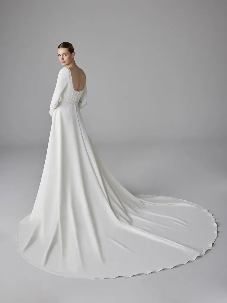 Thumbnail: Pronovias Oropha Crepe Mermaid Wedding Dress with V-Neck and Long Sleeves
