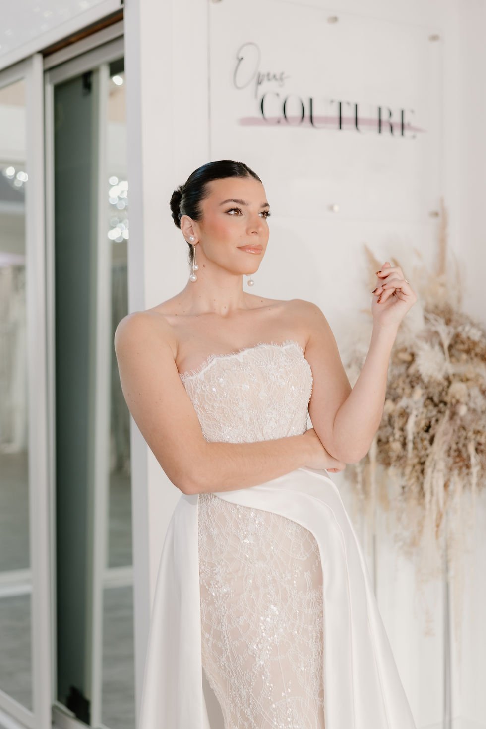 Woman in lace Wona Concept Wedding Dress inside Opus Couture Scotland