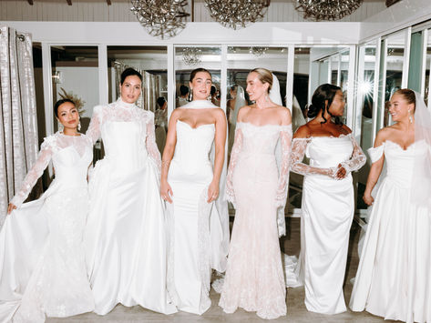 Six models in elegant Wona Concept wedding dresses at Opus Couture bridal store in West Kilbride, Scotland