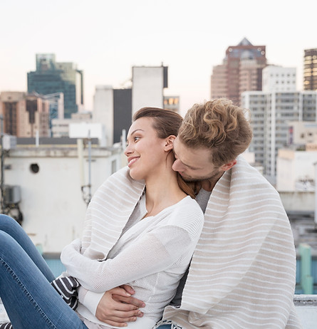 Couple Cuddling on a Rooftop