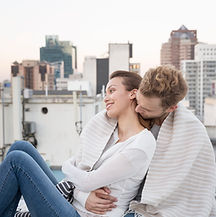 Couple Cuddling on a Rooftop
