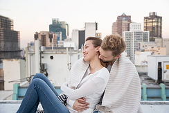 Couple Cuddling on a Rooftop