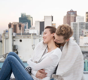 Couple Cuddling on a Rooftop