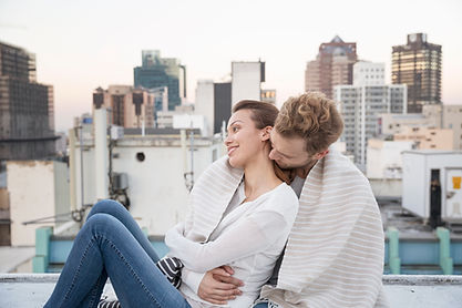 Couple Cuddling on a Rooftop