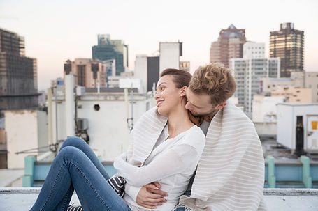 Couple Cuddling on a Rooftop