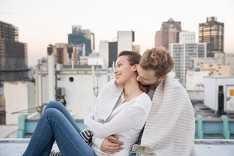 Couple Cuddling on a Rooftop
