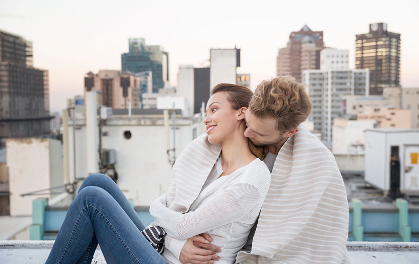 Couple Cuddling on a Rooftop