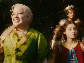 Elf woman in green coat, smiling, with a girl in a colorful sweater and a man in armor in a lush forest setting, all looking hopeful.