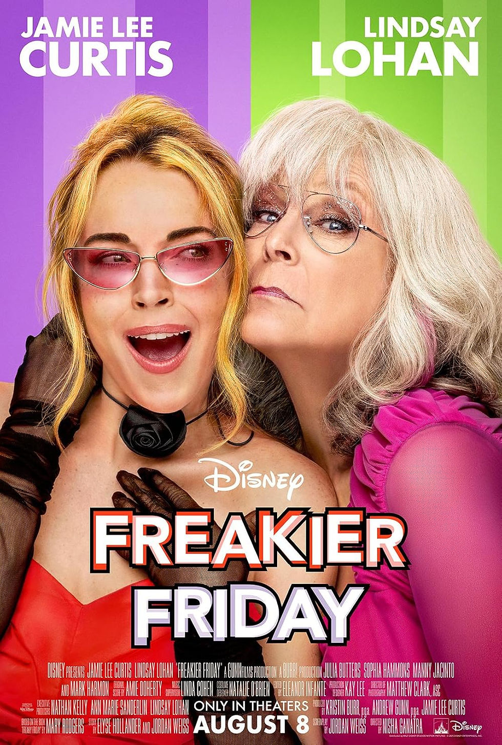 Two women in colorful outfits and glasses pose humorously. Text reads “Disney Freakier Friday August 8.” Bright purple and green background.
