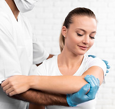 male-physiotherapist-checking-woman-s-shoulder-pain.jpg