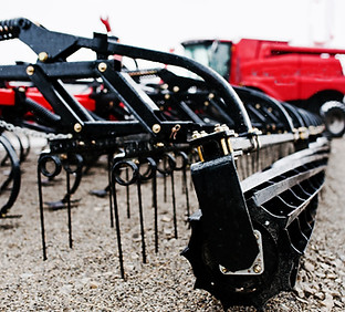 new-red-agricultural-seeder-close-up-view.